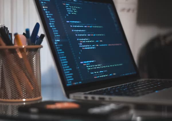 Laptop screen showing code for an eLearning course build