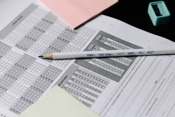 Standardized test answer sheets with a pencil