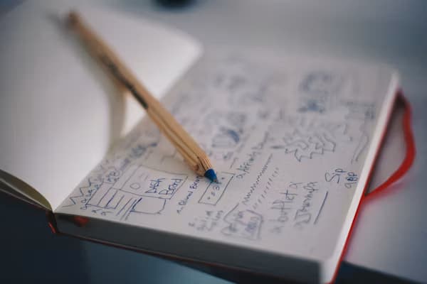 Hand-drawn storyboard notes in a notebook